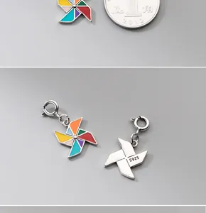 Detailed close-up of colorful enamel pinwheel pendant in S925 sterling silver with hallmark