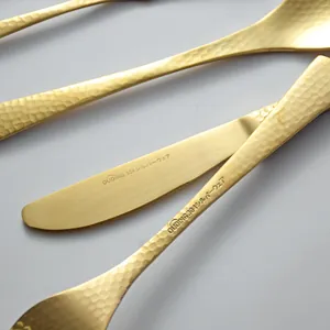 Hammered gold stainless steel cutlery set with elegant matte finish for fine dining