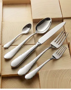 Close-up detail of hammered texture handles on 304 stainless steel cutlery set.
