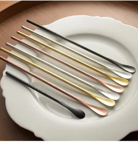 Detailed shot of long-handled stainless steel coffee stirring spoons in assorted colors