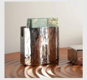Detailed macro view of bark-textured silver stainless steel napkin holder