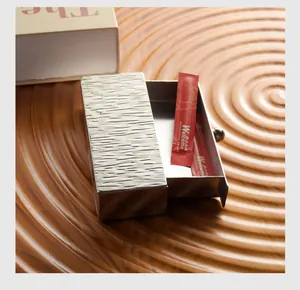 Macro detail of Nordic stainless steel toothpick holder with unique tree bark texture