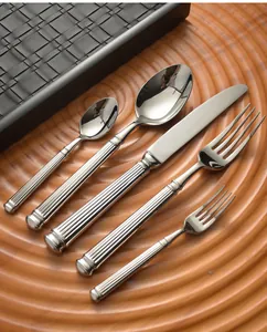 Detailed macro view of 304 stainless steel cutlery set with elegant Roman column handles