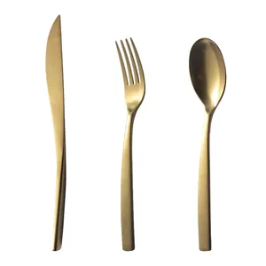 Minimalist matte gold stainless steel cutlery set including steak knife, fork and spoon