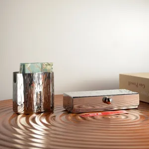 Stainless steel napkin holder and toothpick box set with creative tree bark texture pattern.