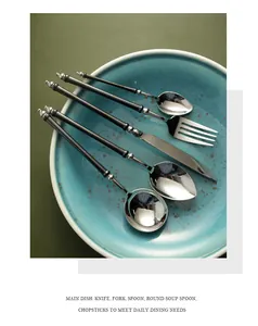 Elegant 304 stainless steel cutlery set with vintage black bamboo-style handles in a bowl