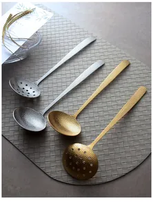 Detailed view of hammered 304 stainless steel gold and silver soup ladles and spoons