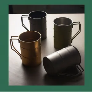 Detailed view of four vintage stainless steel camping mugs in assorted earth tones.