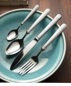 Macro detail showing the honeycomb texture on the handles of stainless steel cutlery