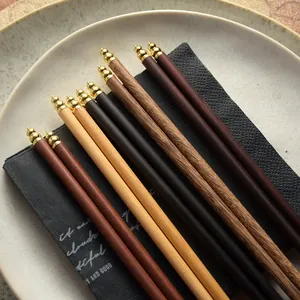 Premium assorted natural wood chopsticks with elegant golden metal tips