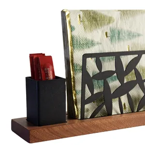 Minimalist black metal napkin holder with wooden base and integrated toothpick cup holder