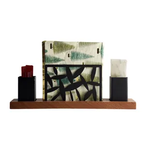 Modern black stainless steel and wood napkin holder with toothpick cups for tabletop.