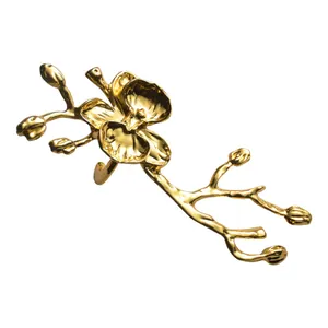 Servilletero de orquídea dorada de lujo para decoración de mesa de restaurante elegante