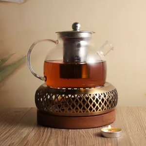 Elegant vintage stainless steel tea warmer set with glass teapot and tealight candle