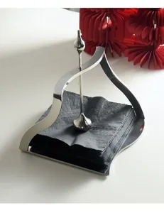 Modern stainless steel napkin holder with elegant curved design for table decor