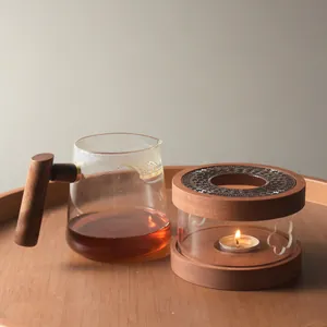 Elegant walnut wood candle tea warmer set with glass teapot on a wooden tray