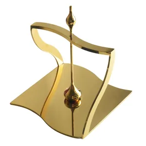 Elegant luxury gold stainless steel napkin holder with modern wavy design for dining tables
