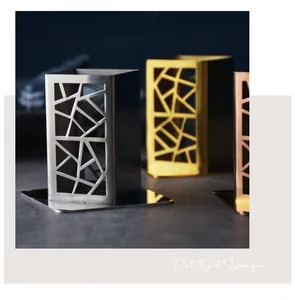 Modern stainless steel toothpick holders with geometric cutout design in various colors