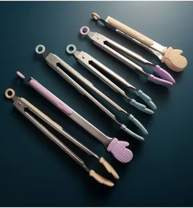 Detail showing multi-color stainless steel food tongs with cute mitten-shaped silicone heads