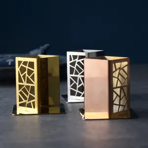 Modern hollow stainless steel toothpick holders in gold, silver, and rose gold finishes