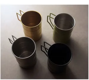 Detailed view of four retro 304 stainless steel camping mugs in different colors
