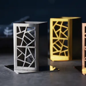 Elegant hollow-out stainless steel toothpick holder in multiple metallic finishes.
