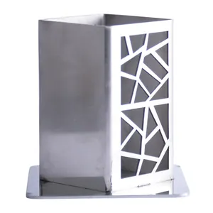 Modern stainless steel toothpick holder with geometric hollow design on white background