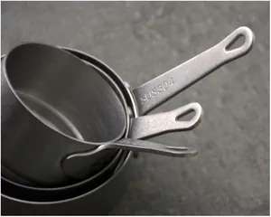 Close-up detail of 304 stainless steel measuring cups with vintage snow-sand finish