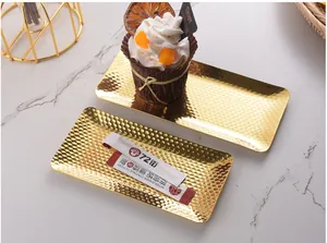 Detailed macro view of a gold hammered stainless steel tray used for snacks and desserts