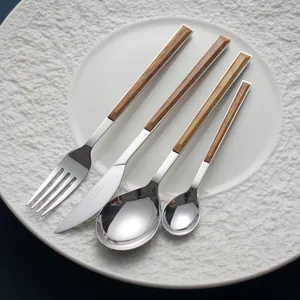 Minimalist 4-piece stainless steel cutlery set featuring elegant wood grain handles