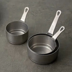 Set of vintage 304 stainless steel measuring cups with snowflake sand finish