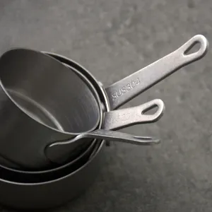 Set of vintage 304 stainless steel nesting measuring cups with a snow sand finish for baking