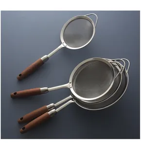 Detail view of high quality stainless steel fine mesh strainers with elegant wood handles