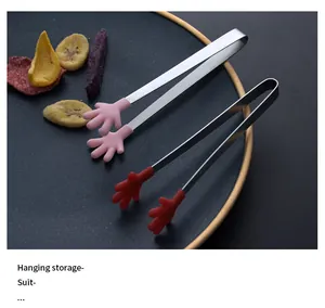 Close-up of creative hand-shaped silicone food tongs for snacks and ice cube serving