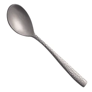 Vintage hammered finish matte stainless steel dessert coffee spoon on a clean white background