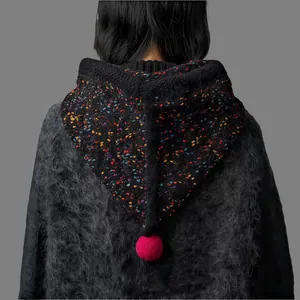 Detailed back view of a cozy black speckled knit Balaclava hood with a bright pink pom-pom