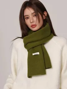 High quality 100% wool green knitted scarf detail shown on female model for winter