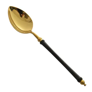 Elegant black and gold 304 stainless steel dinner spoon with a sleek polished finish