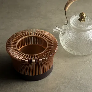 Hollow magnolia design tea warmer base for candle heating and constant temperature.