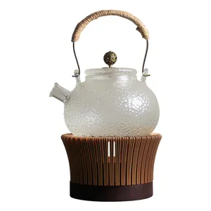 Textured glass teapot set with woven rope handle and bamboo style candle warmer base
