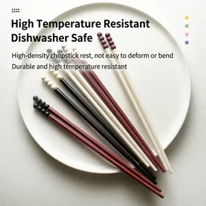 Heat resistant non-slip alloy chopsticks with colorful bead design on white plate