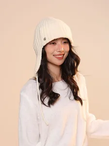 Asian model wearing a white 100% wool knitted Balaclava hat with ear flaps for winter