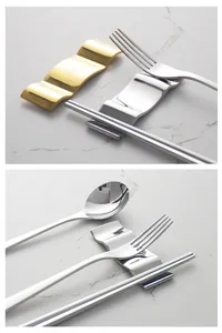 Close-up of minimalist wave-shaped stainless steel cutlery rest with fork and spoon