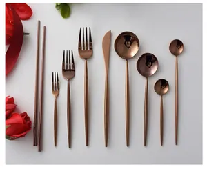 Mirror finish rose gold 304 stainless steel cutlery set featuring forks, knife, and spoons.