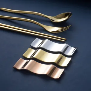 Elegant wavy stainless steel chopstick rest set in gold, silver, and rose gold finishes