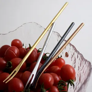 Set of four colorful 304 stainless steel dessert forks in a glass fruit bowl