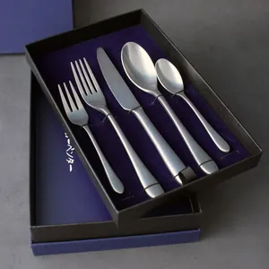 Elegant vintage-style brushed stainless steel cutlery set in a premium navy blue gift box