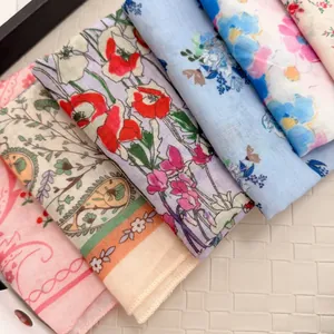 Close-up view showing a variety of pastoral floral and paisley cotton linen square scarves