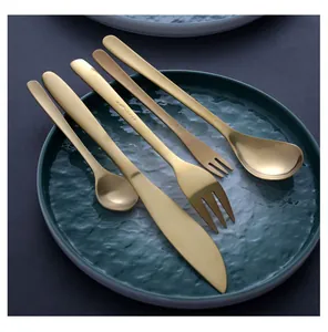 Japanese style gold 304 stainless steel cutlery set with willow leaf handle on plate