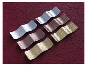 Detailed view of Japanese style hammered stainless steel chopstick rests in multiple colors